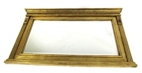 A 20thC gilt framed overmantel mirror, the moulded top with swag and column supports, 70cm high, 116cm wide, 6cm deep.