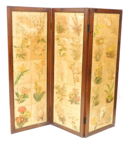 A three fold scrap screen, with panels of floral book plates, each panel 151cm high, 54cm wide, 2cm deep. (AF)