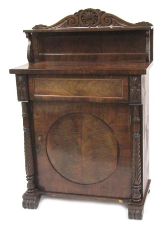 A 19thC flame mahogany chiffonier, with a raised gallery back with shell cap and scroll supports, with single drawer and two cupboard doors formed with a central circle inverted, with column supports and scroll feet, 132cm high, 82cm wide, 41cm deep.