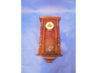 An early 20thC mahogany cased wall clock