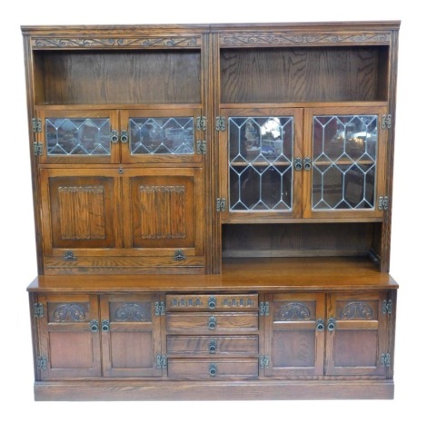 An Old Charm two sectional display cabinet, with sideboard base and arrangement of two display cabinet top, with glazed doors and enclosed cupboards, 192cm high, 186cm wide, 48cm deep.