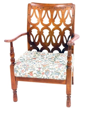 An early 20thC stained beech open armchair, with panelled back on out splayed legs, with tapestry seat. The upholstery in this lot does not comply with the 1988 (Fire & Fire Furnishing) Regulations, unless sold to a known exporter or upholsterer it will b