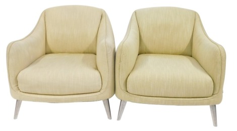 A pair of Patricia Parker Italian deep seated chairs, each with cream mottled upholstery, on chrome supports, model number 2661 003, 81cm high, 74cm wide, 75cm deep.