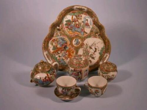 A 19thC Chinese Canton decorated porcelain bachelor tea service comprising a lobed tray