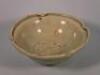 A 19thC Chinese celadon glazed bowl with a lobed edge and decorated to