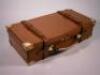 A leather and brass bound shotgun cartridge case by W.W. Greener Ltd