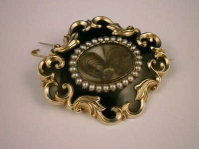 A large Victorian memorial brooch