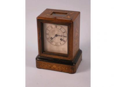 A late 19thC rosewood and marquetry library type mantel clock with a silvered dial