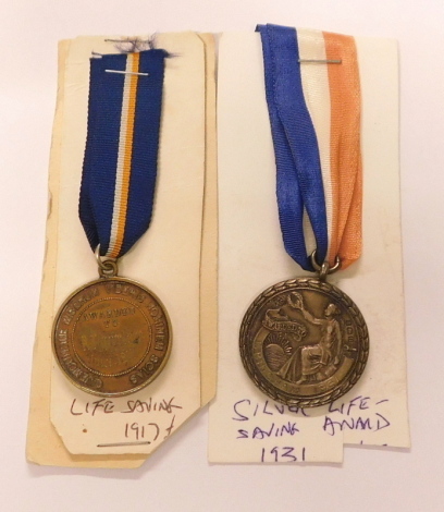 Two Royal Life Saving Society medals, awarded 1917 and a silver 1931. (2)