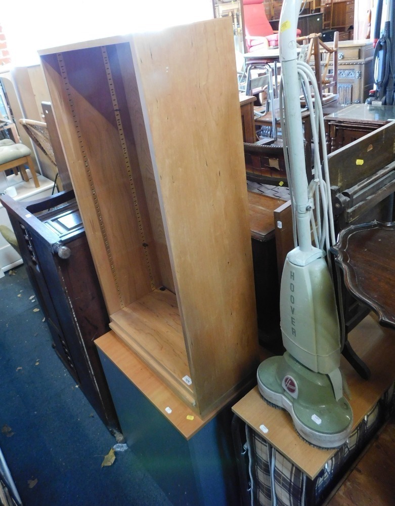 A lightwood open bookcase, filing Hoover vintage cleaner, headboard, deck chair and