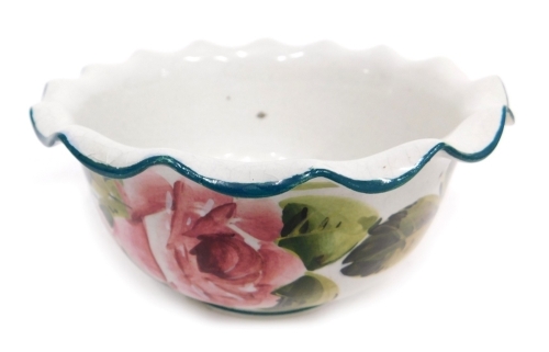 A late 19thC Wemyss pottery cabbage rose bowl, with flared rim, on circular foot, hand painted, impressed and painted marks beneath, 14cm wide. (AF)