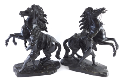 After Coustou. A pair of hollow cast bronze Marly horses, each on rock work bases, signed, 43cm high.