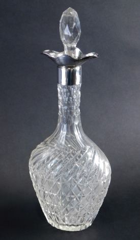 An Edward VII cut glass and silver decanter, with a hobnail cut design and shaped stopper, with flared neck, Birmingham 1909, 38cm high.