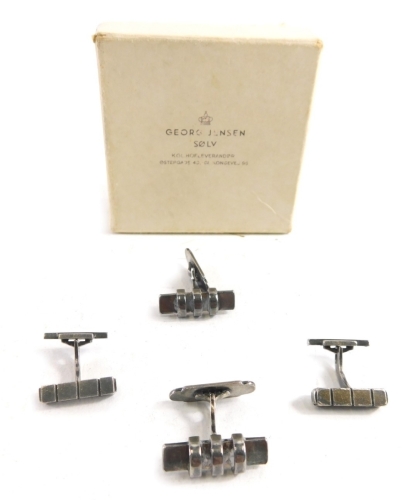 A pair of Georg Jensen silver cufflinks of geometric form, stamped sterling and another pair stamped E & M sterling and a box, 31.7g all in.