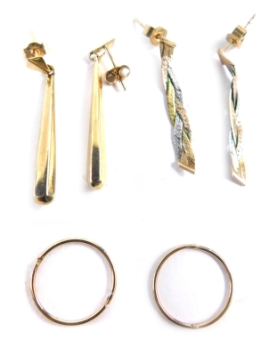 Three pairs of 9ct gold earrings, comprising a pair of drop earrings, small hoops, and tricolour drop earrings, 2.4g. (3)