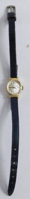 A Seiko 9ct gold cased wristwatch, with small silver coloured dial, serial number 4500603, on a leather bracelet, 4cm diameter, 8.2g all in. - 2