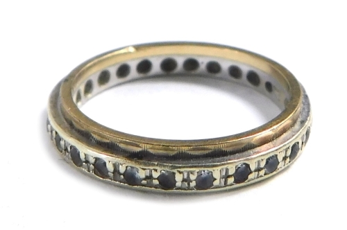 A 9ct gold eternity ring, two line design set with cz's, size K½, 2.4g.