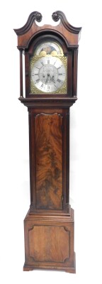 John Ivison, Carlisle. A George III mahogany longcase clock, the brass dial with moon phase subsidiary date aperture and engraved with scrolls, with an eight day movement, in a figured mahogany case on short bracket feet, 225cm high.