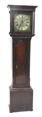 Joshua Mosley Penistone. An 18thC oak longcase clock, with 5cm wide Roman numeric and Arabic dial, thirty hour movement with subsidiary second hand and raised spandrels, flanked by columns above a shaped trunk door, on scroll feet, 200cm high.