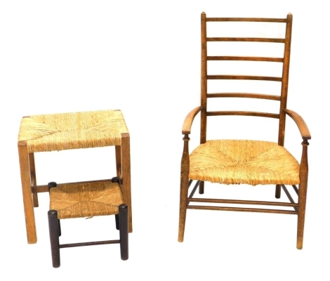 An early 20thC country child's ladderback chair, with rope seat, on turned legs, 86cm high.