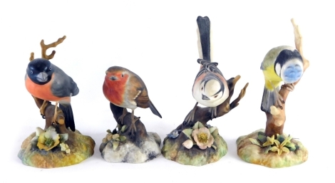 Four Royal Crown Derby matt glazed birds, to include robin by P Whittaker, 11cm high, various others, etc. (4)