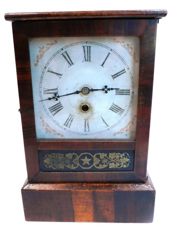 A late 19thC American mantel clock by The Ansonia Brass and Copper Company, with printed and painted dial, in a rosewood case, the door with gilt verre eglomise decoration, 50cm high.