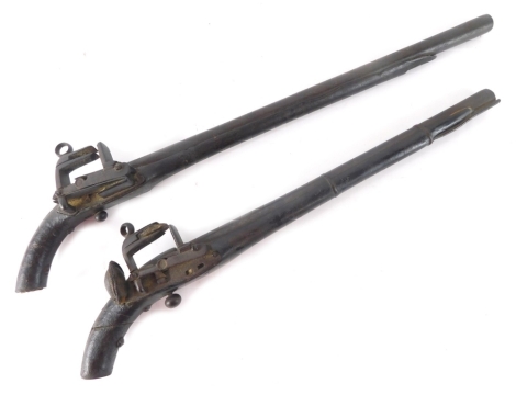 A pair of 19thC Eastern European Caucasian Miquelet pistols, probably Russia or Georgia, 50cm long. (2 AF)