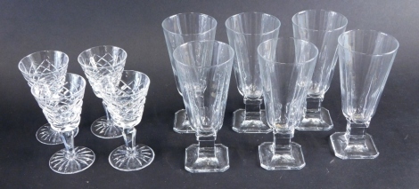 A set of four Waterford crystal sherry glasses, each hobnail cut 13cm high, and six further champagne glasses. (a quantity)