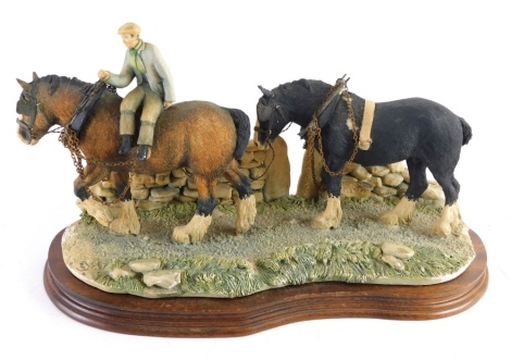 A Border Fine Arts figure group figure and heavy horses, stamped 1985, marked EH, 23cm high.