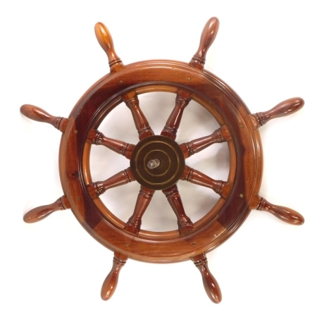 A modern ship's wheel, with brass centre, 61cm wide.