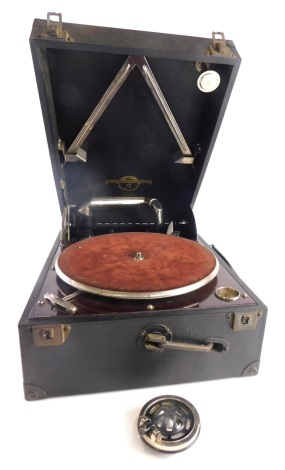 A mid 20thC Columbia 1124 gramophone, with a baize lining and chromed 26cm turntable, and a chrome arm in a pressed leather case, 18cm high.