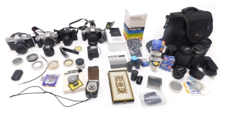 Various cameras and related equipment, a case containing a quantity of lenses, to include Pentax, Vivitar lens, a Praktica camera with Tamron lens, Pentax Super A, Cosina 20mm 1:3.8 lens, Canon EOS 500 camera, Nikon digital camera, etc. (a quantity)