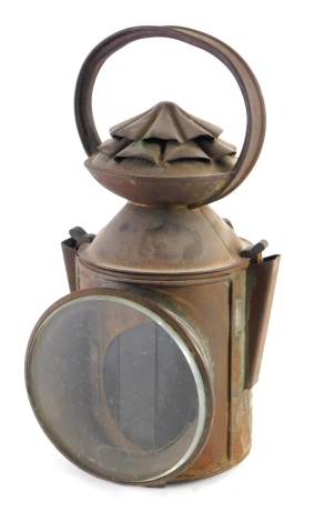 A Great Northern Railway Spilsby Road Crossing railway lantern, with fixed handle, cylindrical body and front glass, labelled, 32cm high.