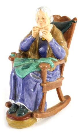 A Royal Doulton figure A Stitch in Time, HN2352, printed marks beneath, 15cm high.