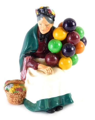 A Royal Doulton figure The Old Balloon Seller, HN1315, printed marks beneath, 22cm high.