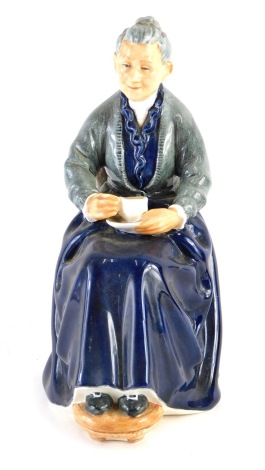 A Royal Doulton figure The Cup of Tea, HN2322, printed marks beneath, 20cm high.