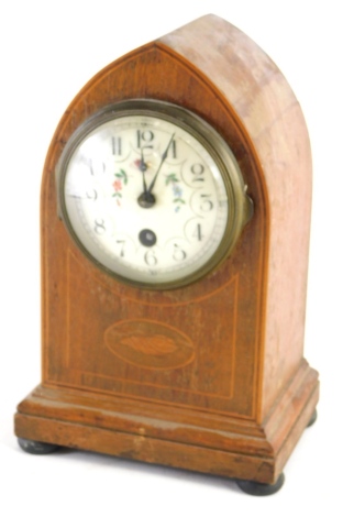 A 19thC mahogany dome topped mantel clock, with floral Arabic 9cm diameter dial, inlaid case, keywind movement striking on the hour, on compressed orb feet, 26cm high.