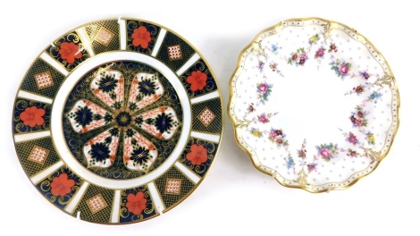 A Royal Crown Derby Imari pattern plate, printed marks beneath, 23cm diameter, and a further Royal Antoinette plate. (2)