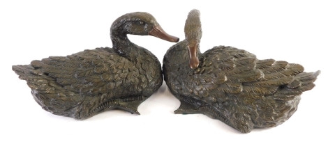 A pair of bronzed resin figures of ducks, unmarked, 17cm high.