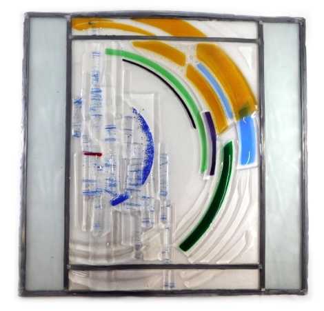 A Vital Peeters stained glass and lead panel, decorated with rainbow type geometric sequence, in yellow, blue, green and purple, signed and dated 2005, 67cm x 70cm.