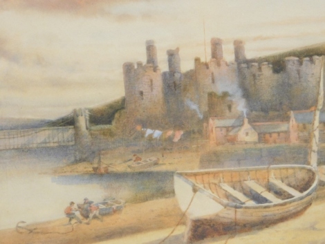 •20thC School. Figures aside rowing boat, with further boats on a shore with building and castle ruin in the distance, watercolour, unsigned, 22cm x 31cm.