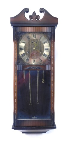 An Acctim eight day wall clock, in walnut case, 78cm high.