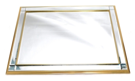 A modern rectangular wall mirror, with bevel glass in sections, 105cm x 73cm.