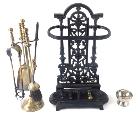 A cast iron umbrella stand in the manner of Coalbrookdale, with pierced floral back and shaped base, 59cm high, a brass companion stand, whistle, and chrome plated dish. (a quantity)