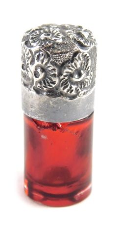 A Victorian silver and cranberry glass miniature scent bottle, probably Birmingham 1895, lacking stopper, 4cm high.