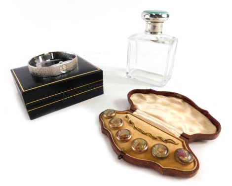 An Accurist cocktail watch, in fitted case with paperwork, a cut glass perfume bottle with silver and enamel lid, and a collar stud set. (a quantity)