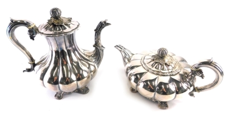 An early 20thC silver plated two piece tea and coffee service, comprising coffee pot, 27cm high, and melon shaped teapot, each with thumb mould handles on scroll feet. (2)