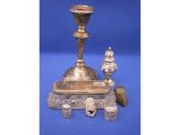 A silver candlestick, pepper pot, cut glass jar with silver lid, various