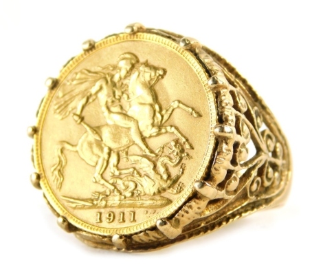 A George V gold full sovereign 1911, in 9ct gold basket weave ring setting, size W, 15.6g all in.