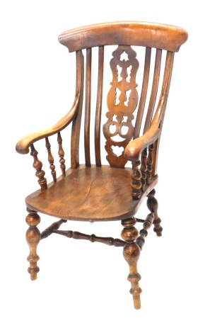 A 19thC ash and elm grandfather chair, with serpentine vertical back, pierced splat, scroll arms and turned front legs, 113cm high.